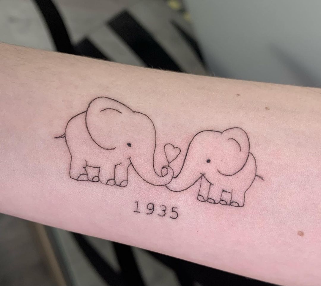Memorable Love Elephants Forearm Tattoo