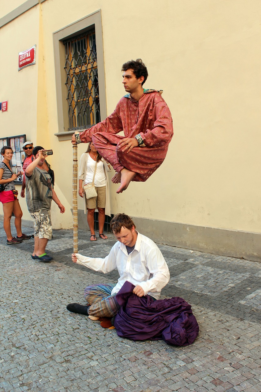 Two magicians performing a floating trick.