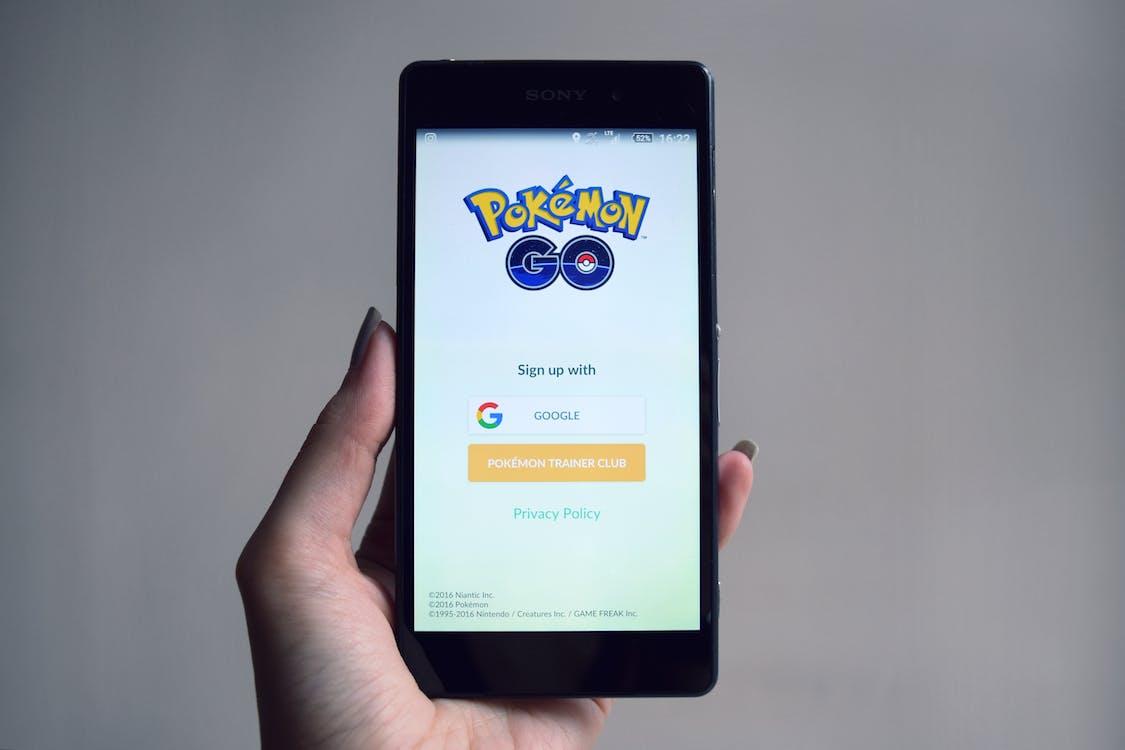 Free Pokemon Go Application on Smartphone Screen Stock Photo