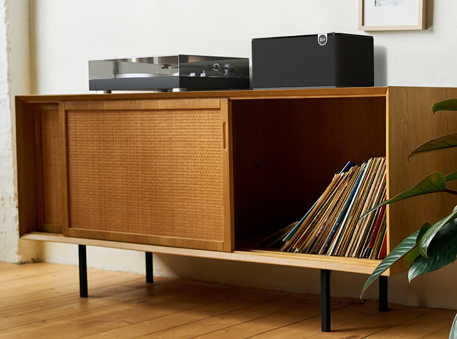 Klipsch The Three Plus tabletop speaker connected to a turntable.