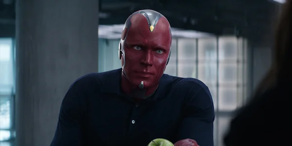 Vision wearing normal clothing. A dark colored henley