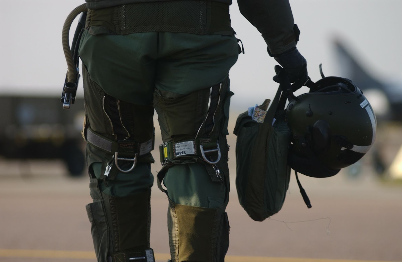 A fighter pilot walking to their jet.