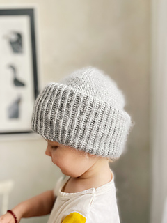 toddler wearing a gray knit hat