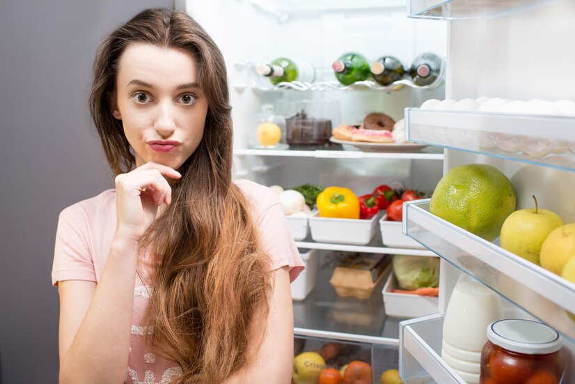 woman near refrigerator