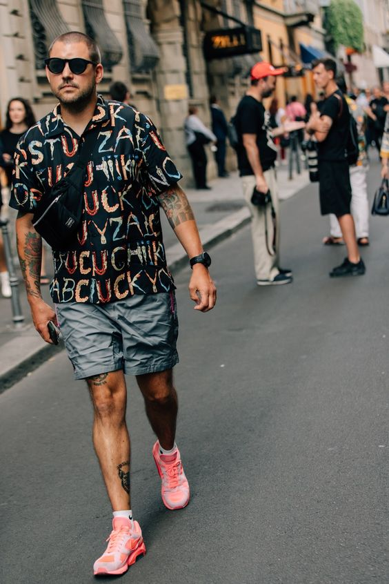 man carrying crossbody bag