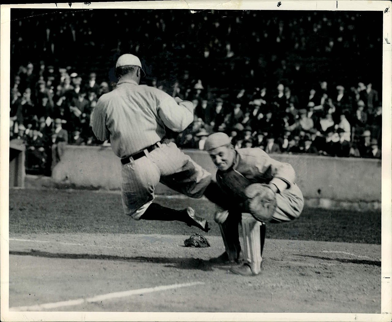Cobb violently crashing into St. Louis Browns catcher Paul Krichell in 1912 to make him drop the ball.