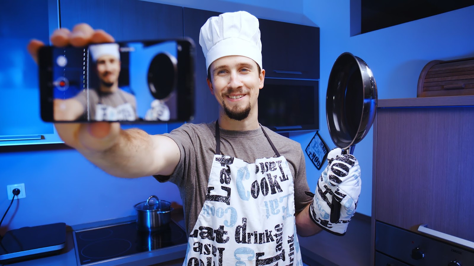 How to find influencers: person wearing a chef's hat recording himself using his phone