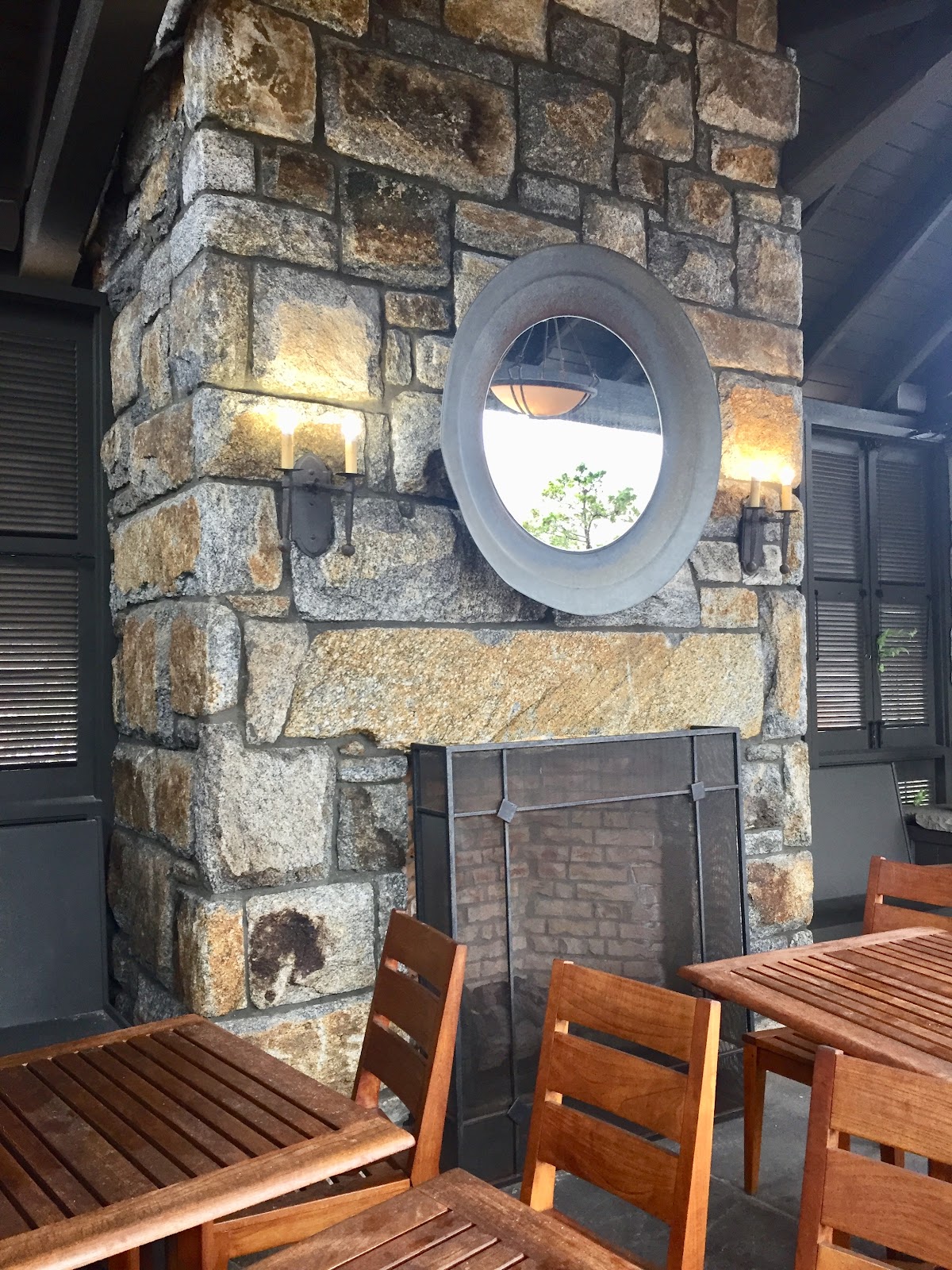 Large Stone Fireplace With Mirror