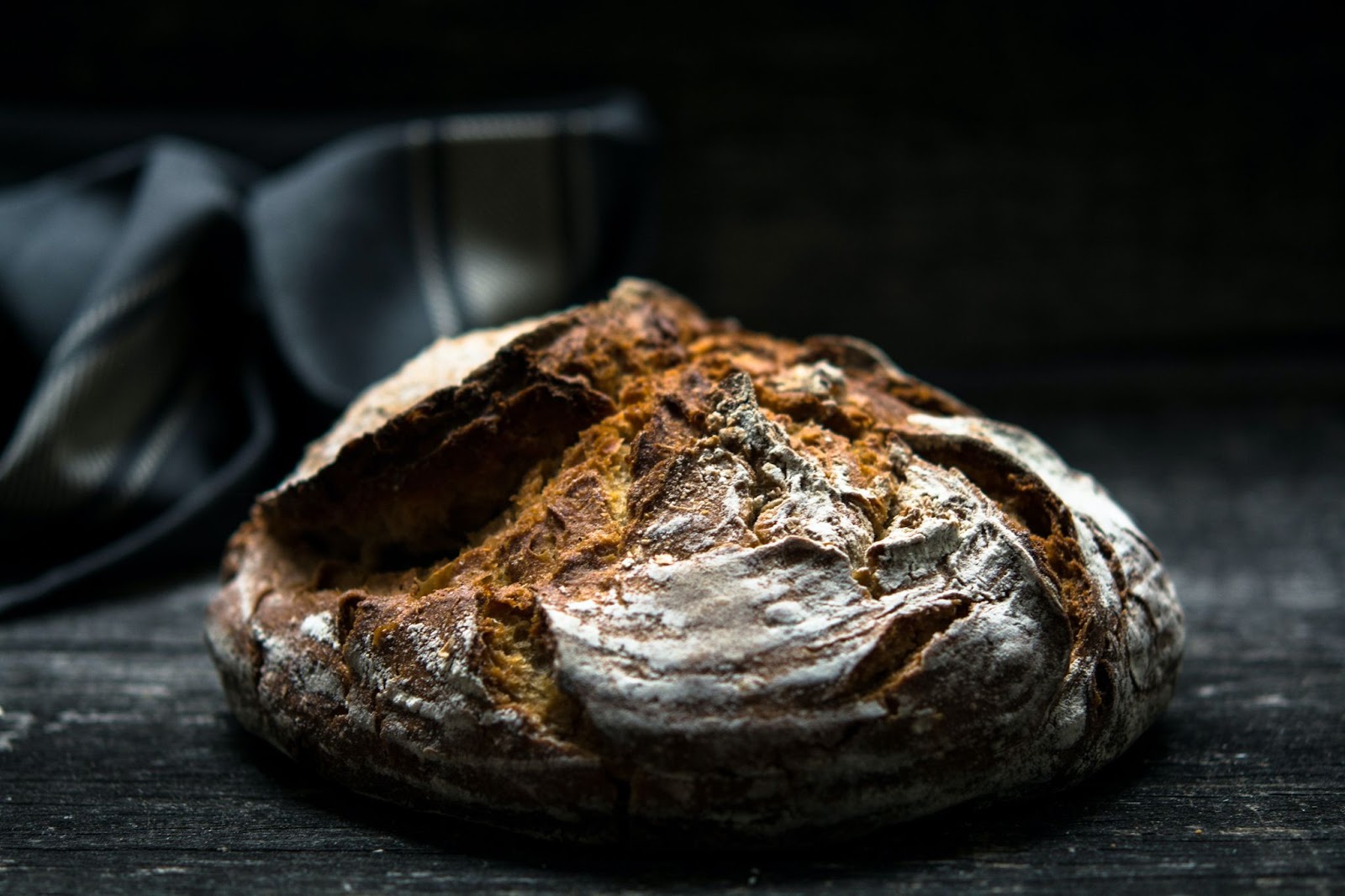 Oooh, the most premium looking of bread. Dark, rye dough in front of a black, silk curtain