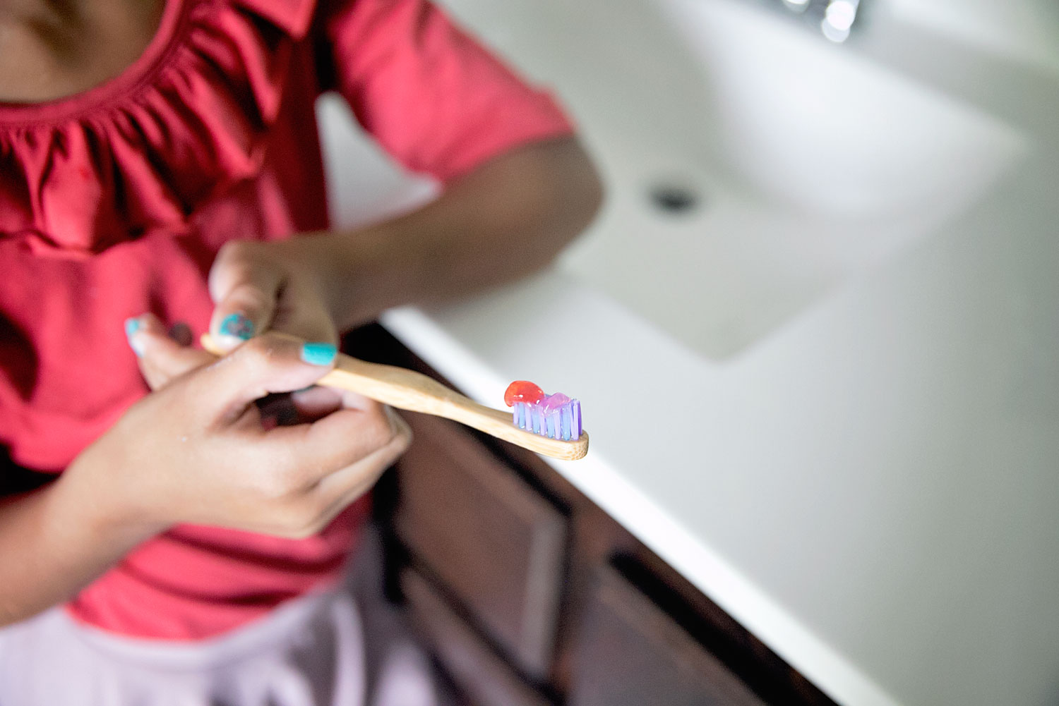 This is our mission to find the best kids toothpaste. Little girl brushing her teeth. 