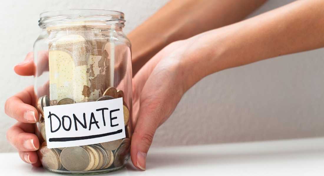 money jar with a label that reads donate