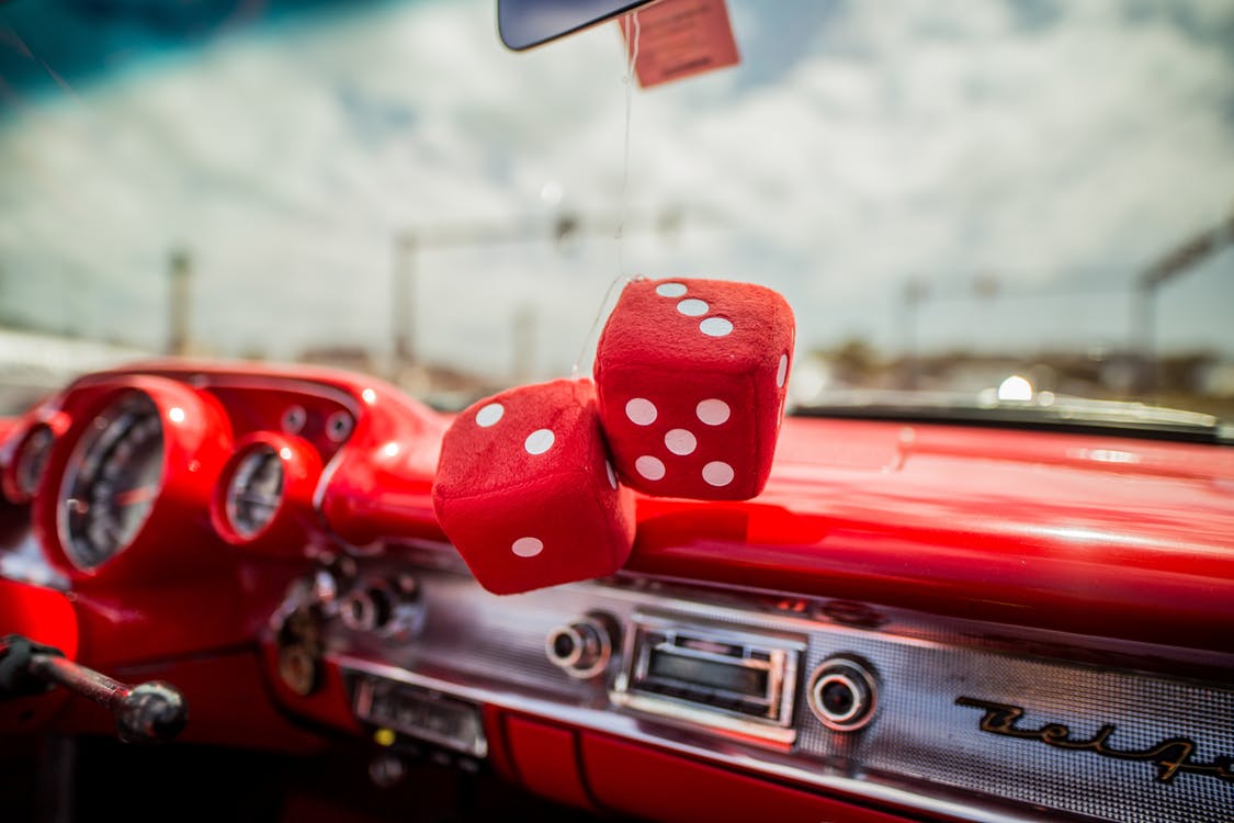 Two Red Dice Decor Hanging inside Red Car