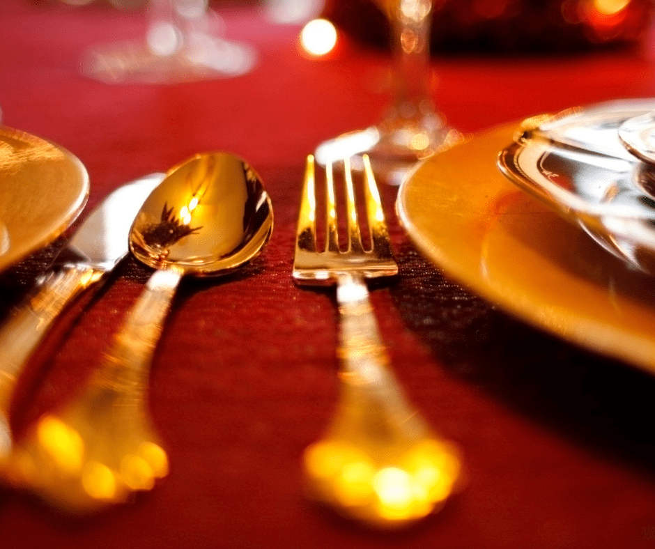 Shiny gold spoons on res table cloth