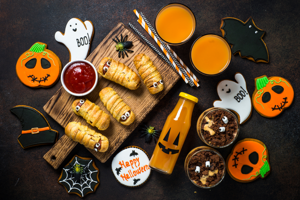 variety of Halloween food and snacks on a table