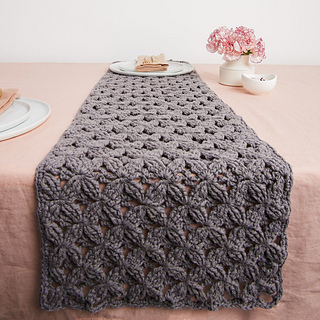 textured gray table runner on table