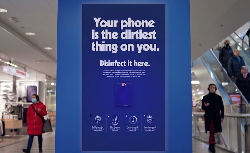 Terveystalo billboard campaign with text "Your phone is the dirtiest thing on you. Disinfect it here."