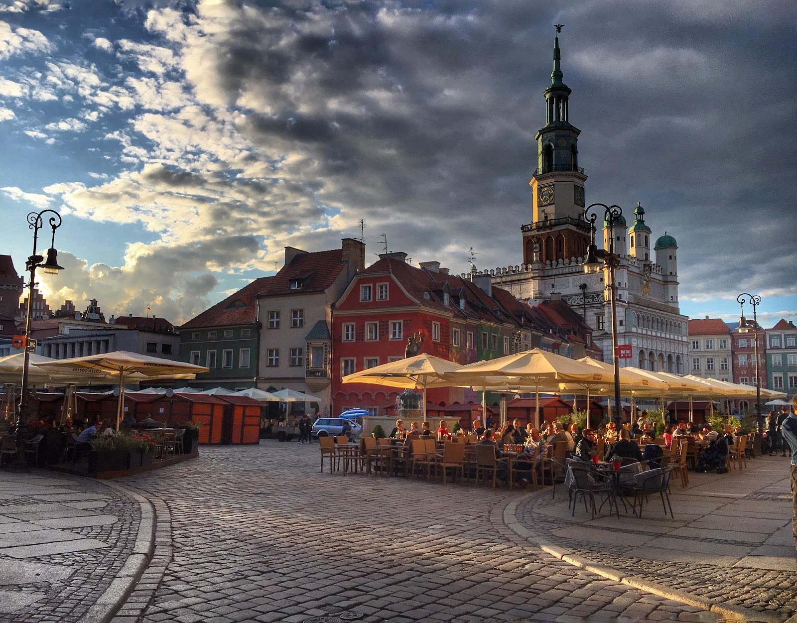 outdoor restaurant in poznan old town square on a cloudy summer day in poland