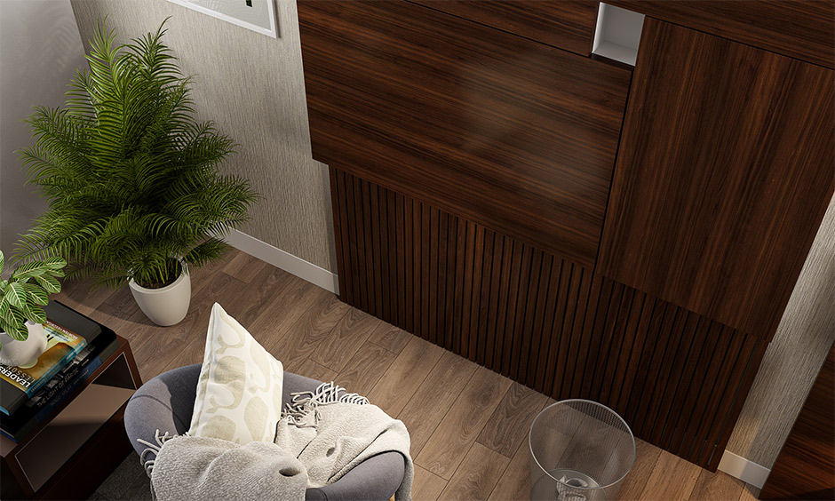 Folding wall table for small spaces finishes in a dark brown veneer