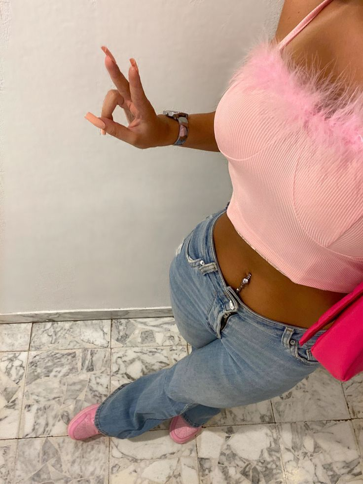 lady wearing corset top, jeans and pink Jordans