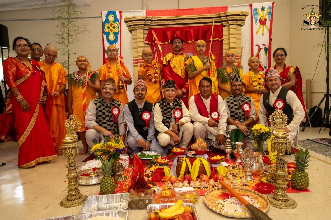 A group of people posing for a photo with Venkateswara Temple, Tirumala in the background

Description automatically generated