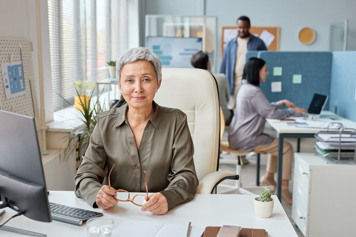 Behavioral health billing software: senior employee smiling at the camera