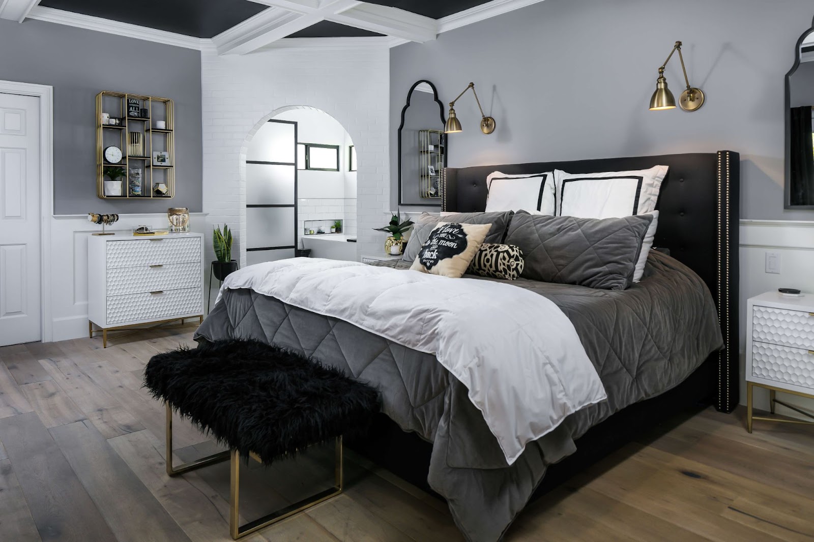 A black and white bedroom with gold accents in Phoenix.