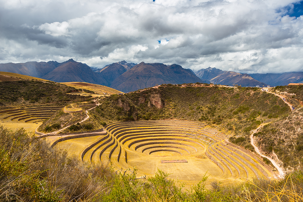 Wide angle view of the glowing majestic concentric terraces of Moray, . Top Tourist Attraction in Peru