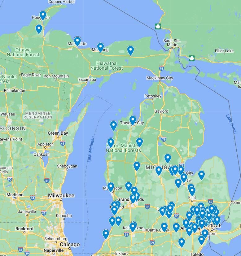 A map of Michigan with pins showing the locations of volunteer leaders. There are 6 pins across the northern UP, a few scattered in the northern Lower Peninsula, a small cluster of pins around the Bay City region, a small cluster in the southwest (Grand Rapids and Holland), and the largest cluster in the southeast (Ann Arbor and Detroit).