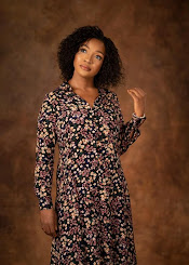 A person in a floral dress

Description automatically generated with low confidence