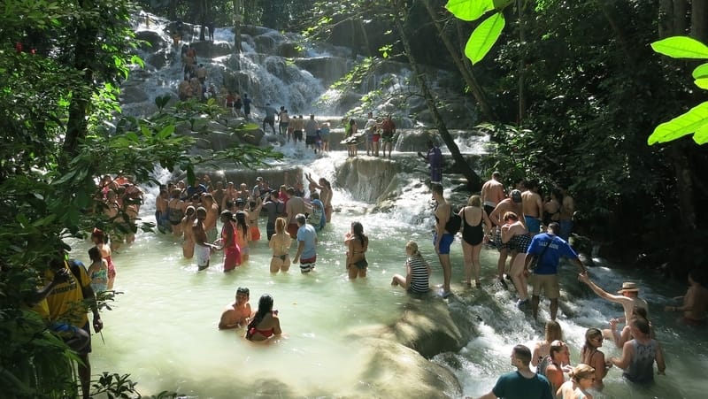 tourists climbing Dunn's river falls