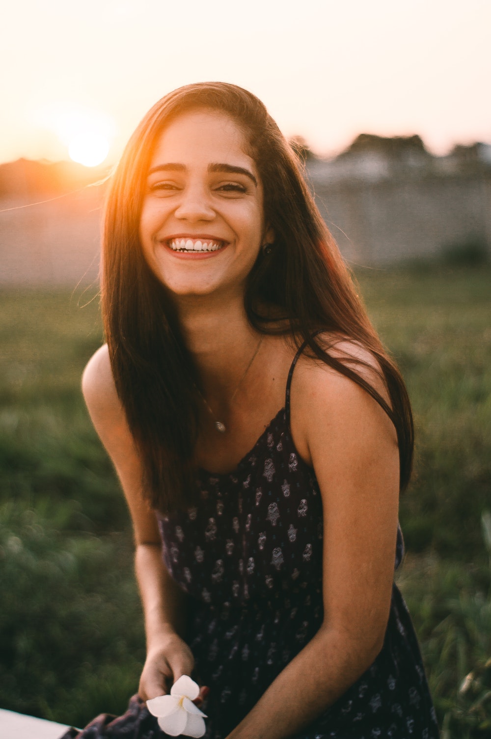 woman smiling in selective focus photography