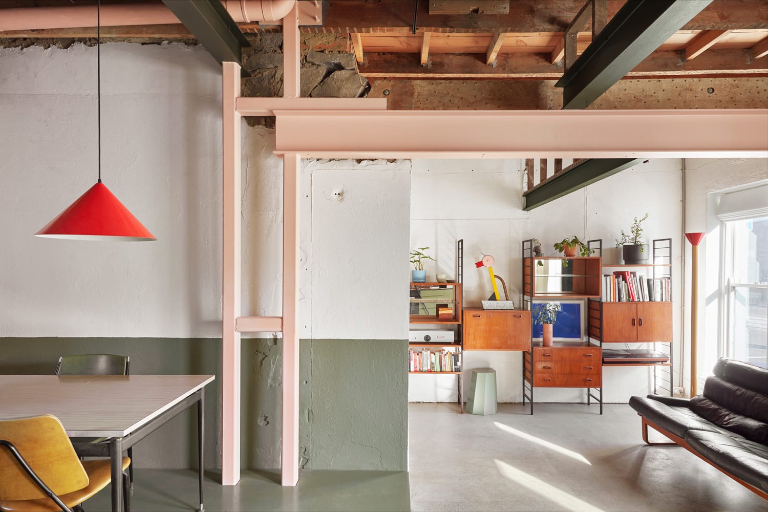 Industrial style with bright pastel beams to soften the entire space