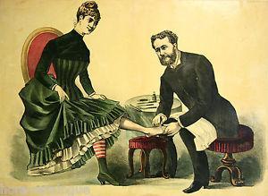man performing european pedicure on woman