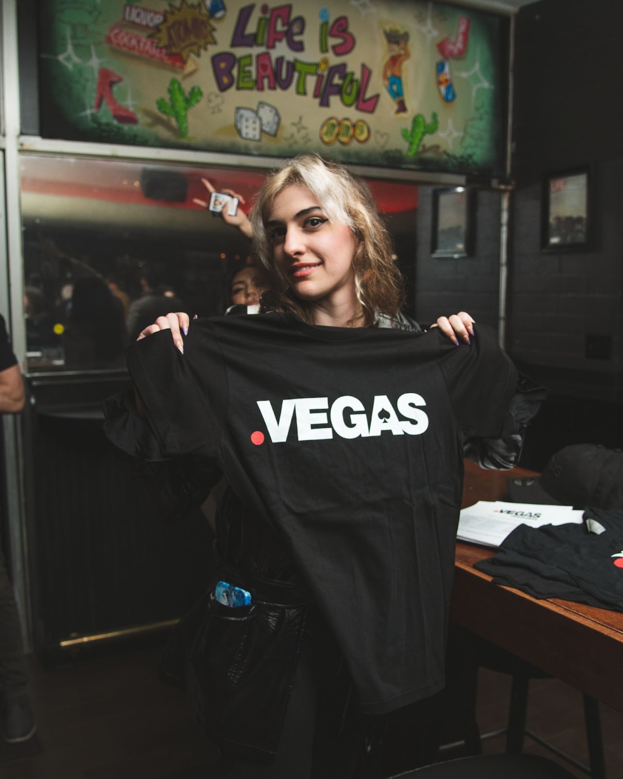 Local Las Vegas business professional receiving .Vegas t-shirt