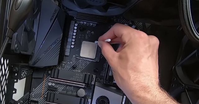Using Cotton Swab to Remove Thermal Paste