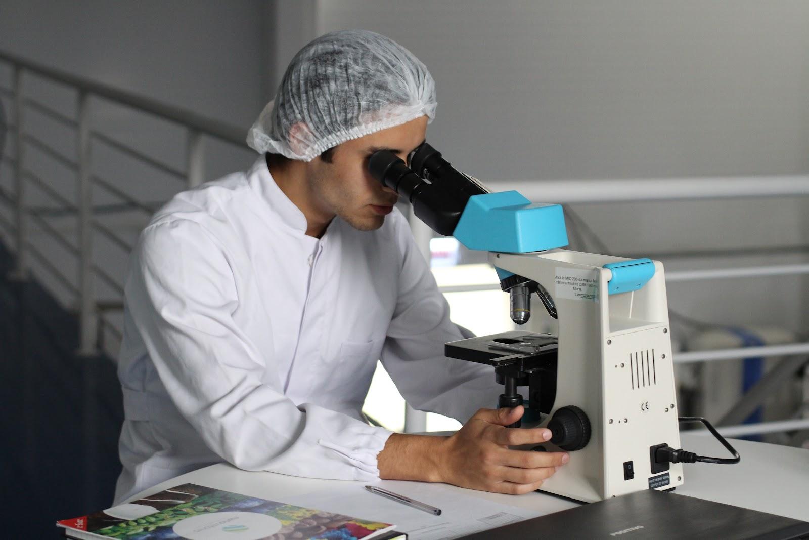 Person looking in a microscope