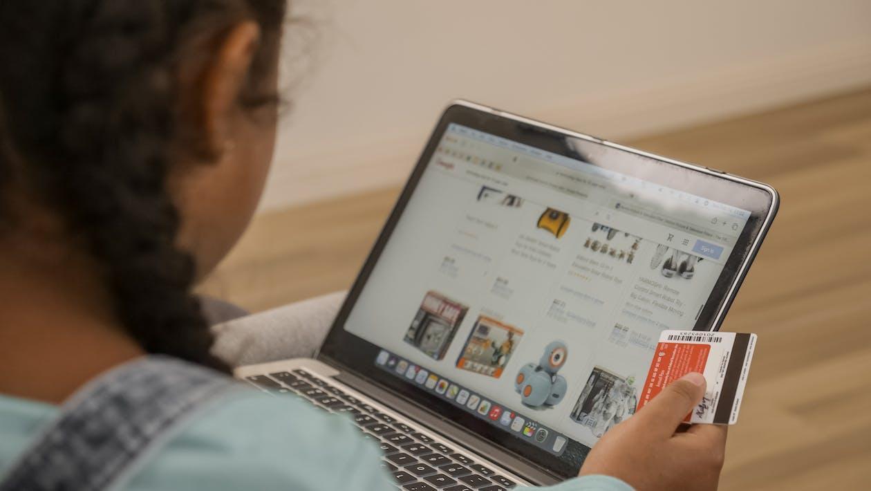 Free A Kid Doing Online Shopping Stock Photo