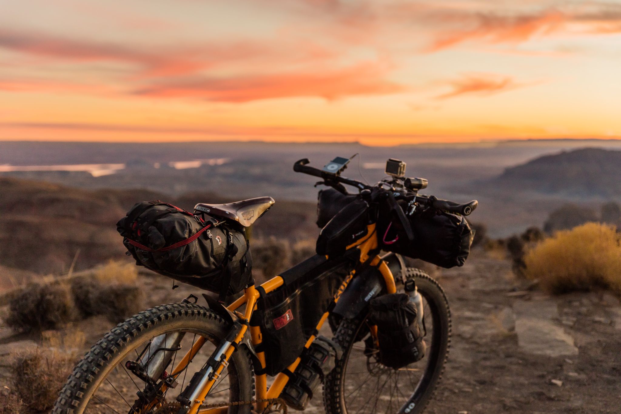 Mountain bike on a hill in the sunset 