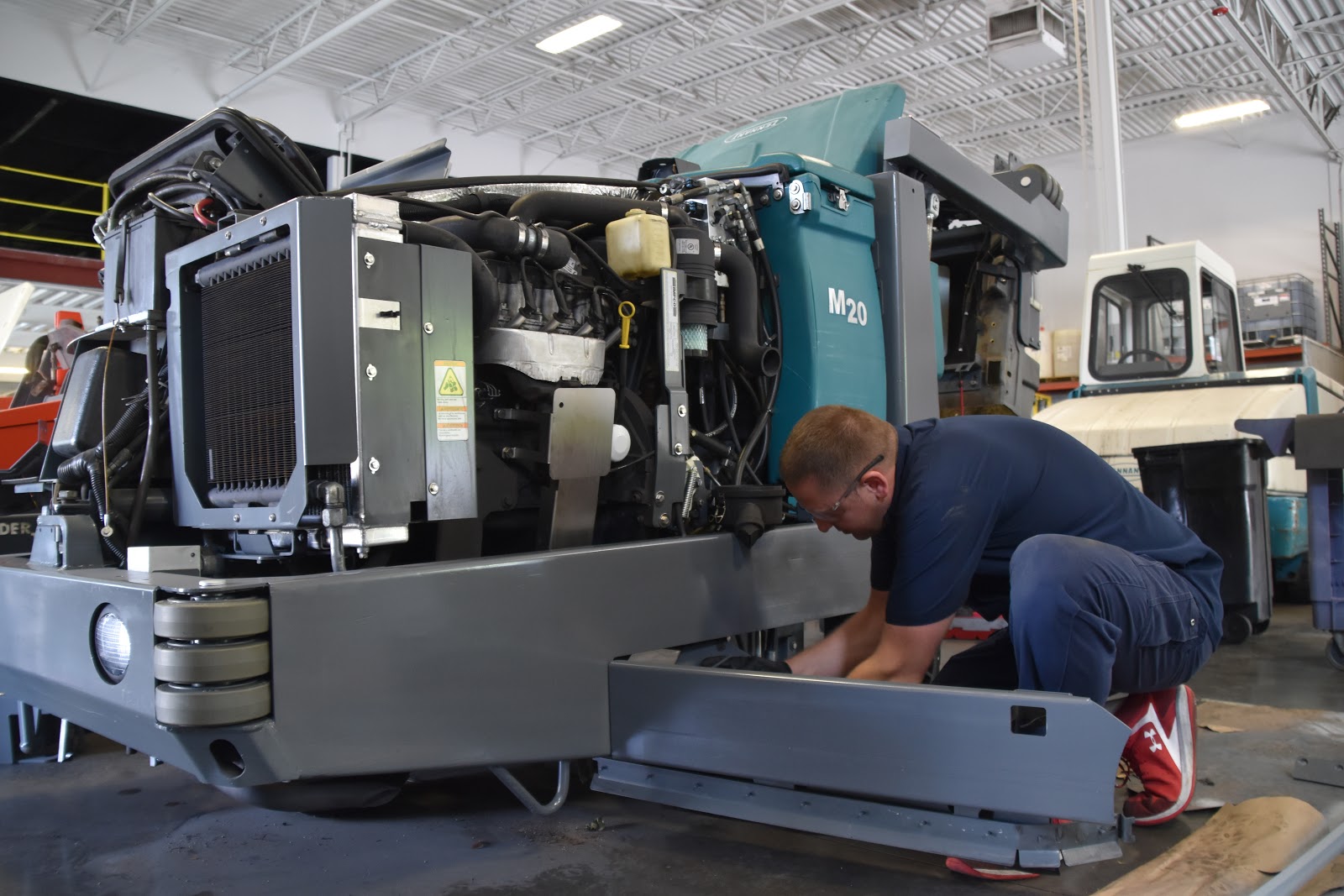 Used Tennant M20 floor scrubber being serviced by FCE expert floor machine technician