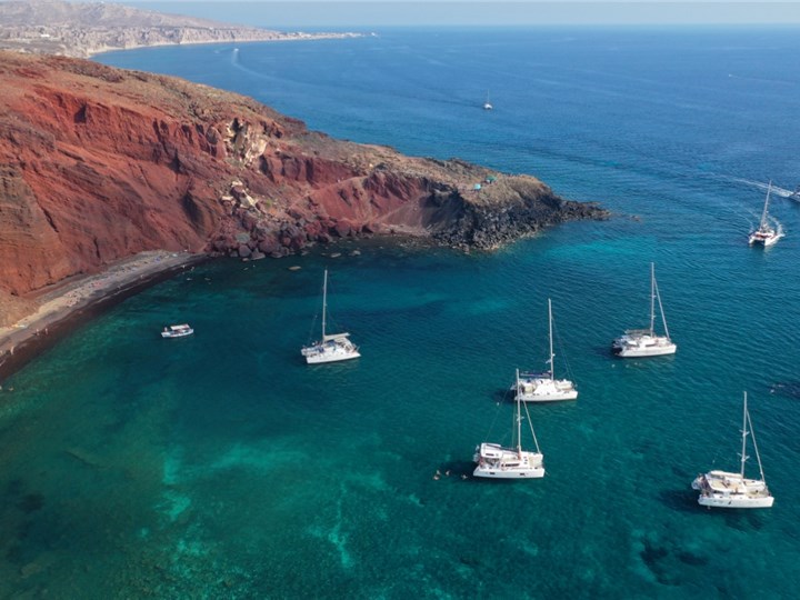 Watching unique views on red beach is a memorable thing to do in Santorini, Greece.