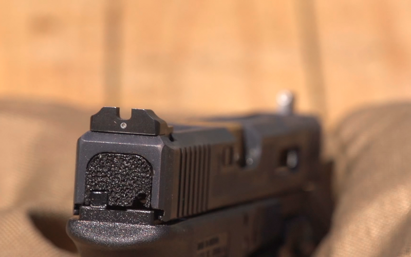 Close-up of iron sights on pistol