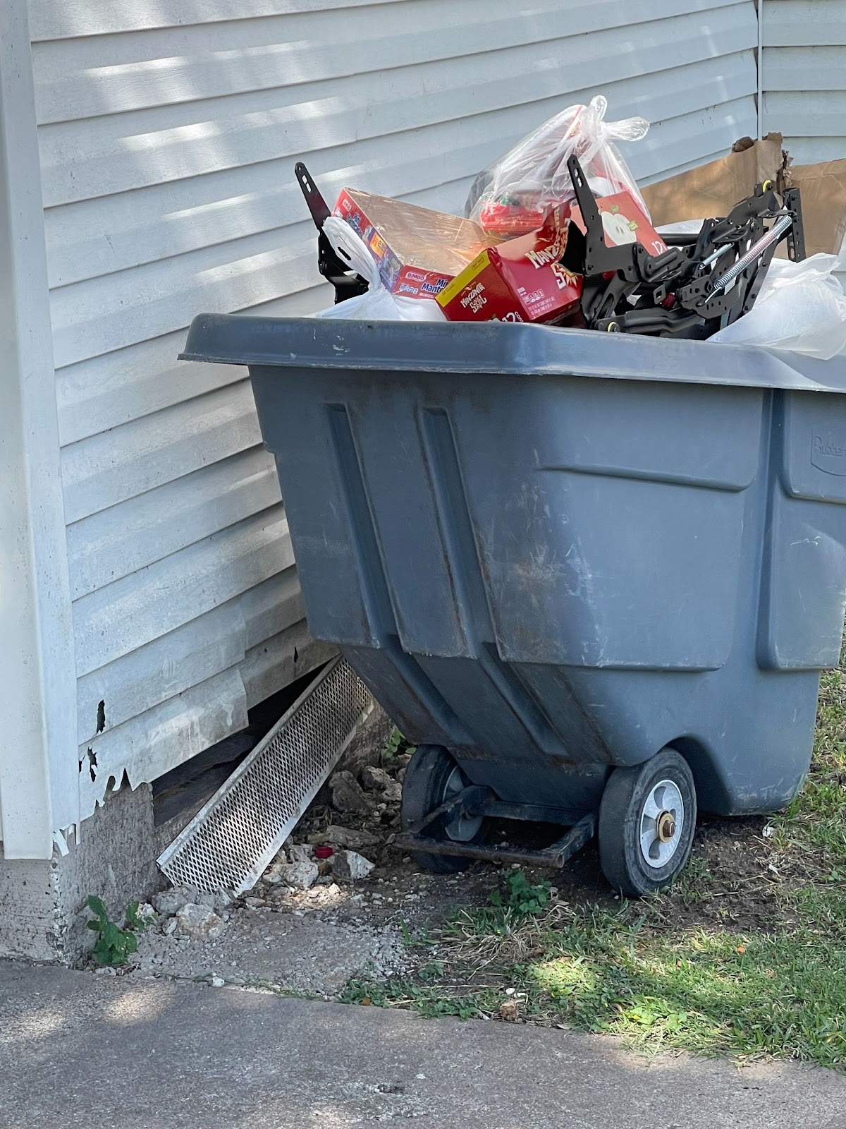 Overflowing garbage cart