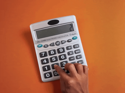 person computing rates on a calculator