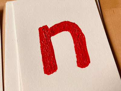 red letter n with textured paint for toddler tracing
