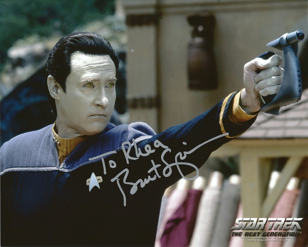 Data from star trek posing with a blaster