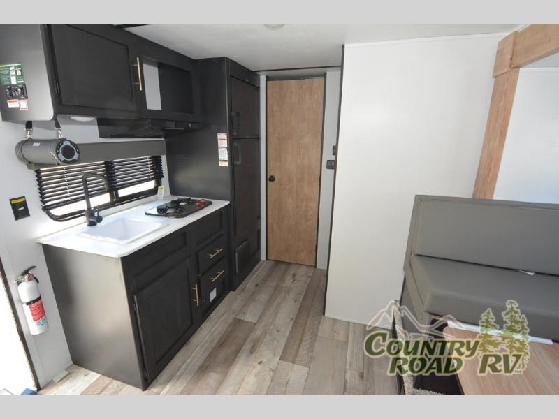 The kitchen in this RV is compact, but with everything you need.