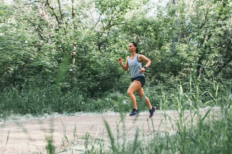 Athlete running on a trail. 