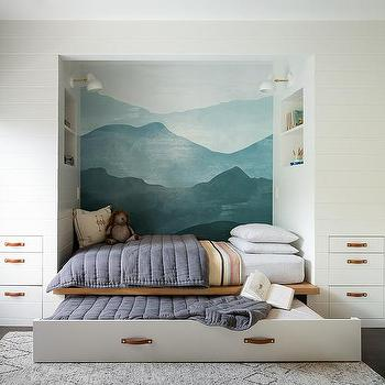 A built-in trundle bed like this one is a super space-saving idea for small rooms or kids’ rooms.