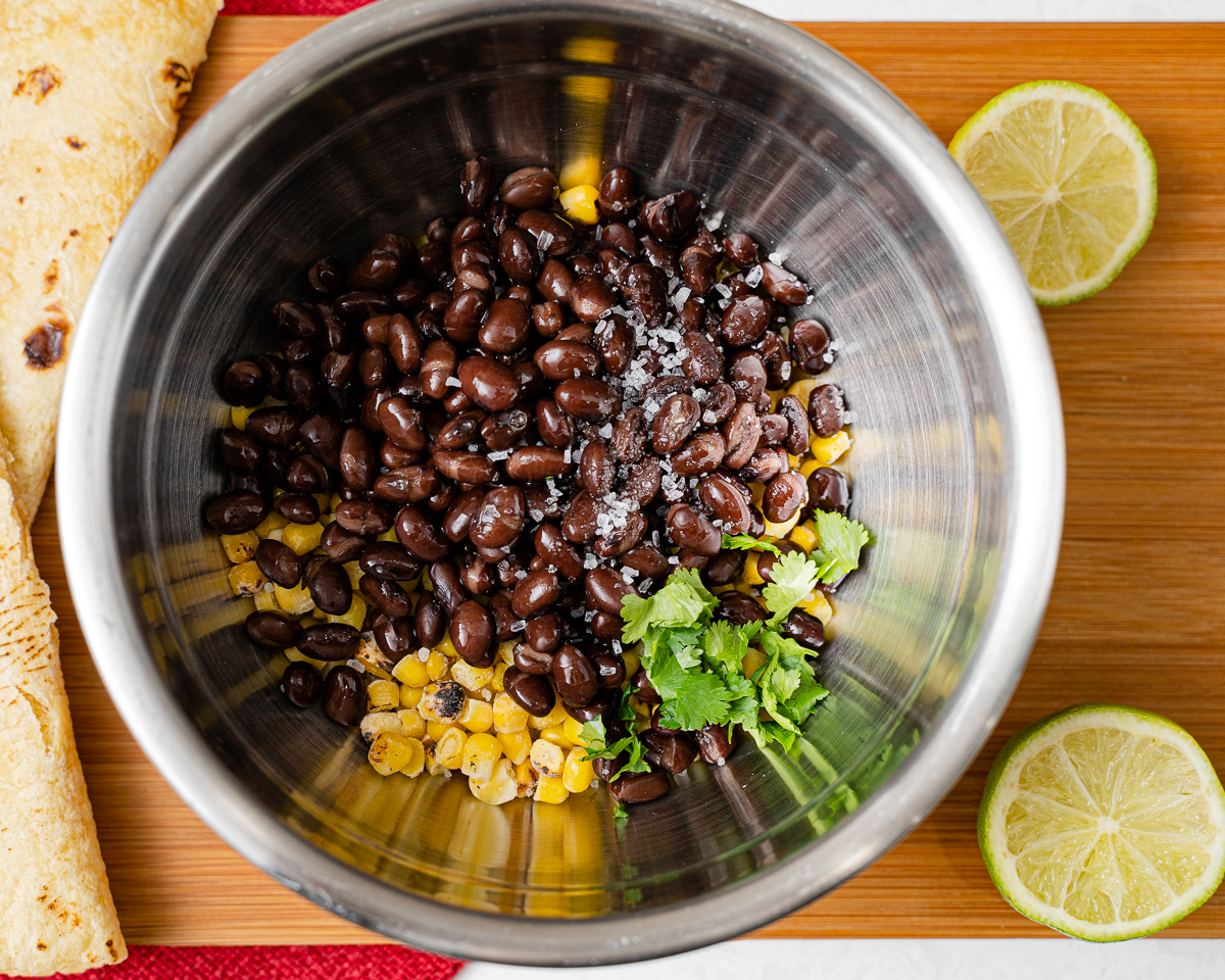 beans, corn, cilantro and lime juice in a bowl tossed with salt and pepper