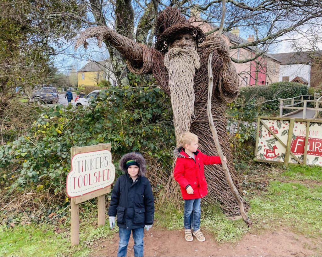 Four year old twins by the wicker man at Bluestone
